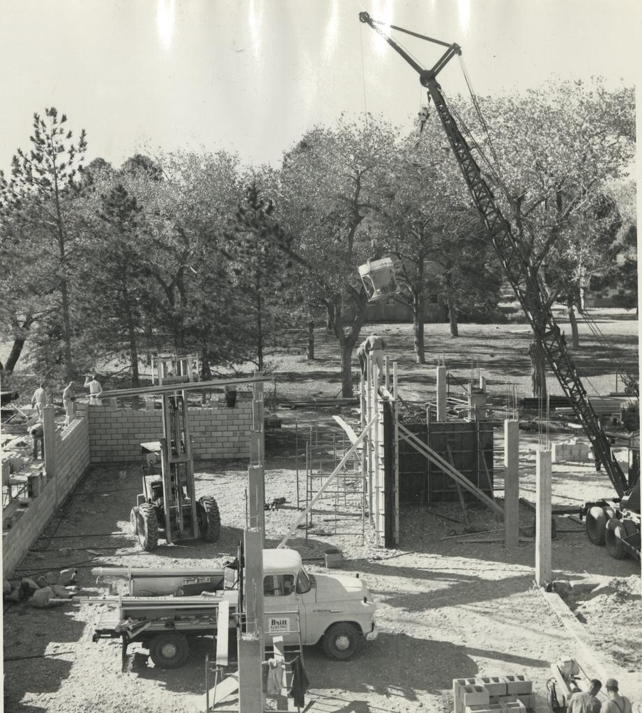 Construction in 1963 of the add ons to the C & J Building with Sara Raynolds Hall and R-1 building in the background.